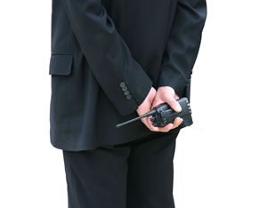 Security personnel with two way radio