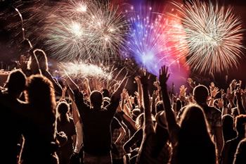 Cheering crowd at fireworks display