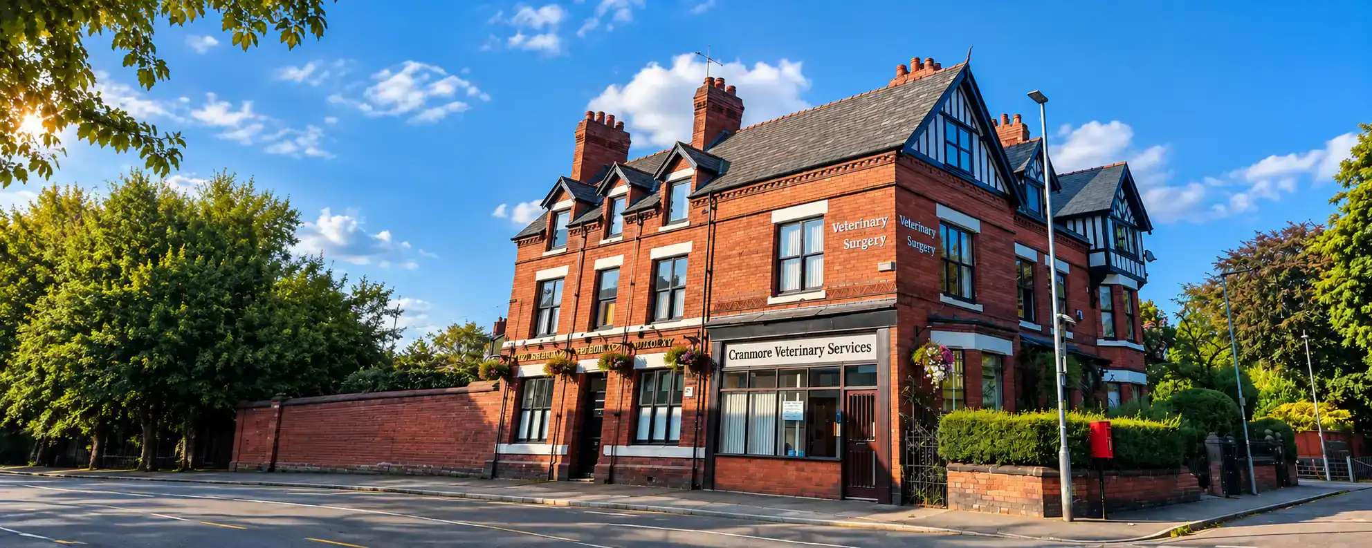 Cranmore Veterinary Surgery building with red brick exterior and blue sky.