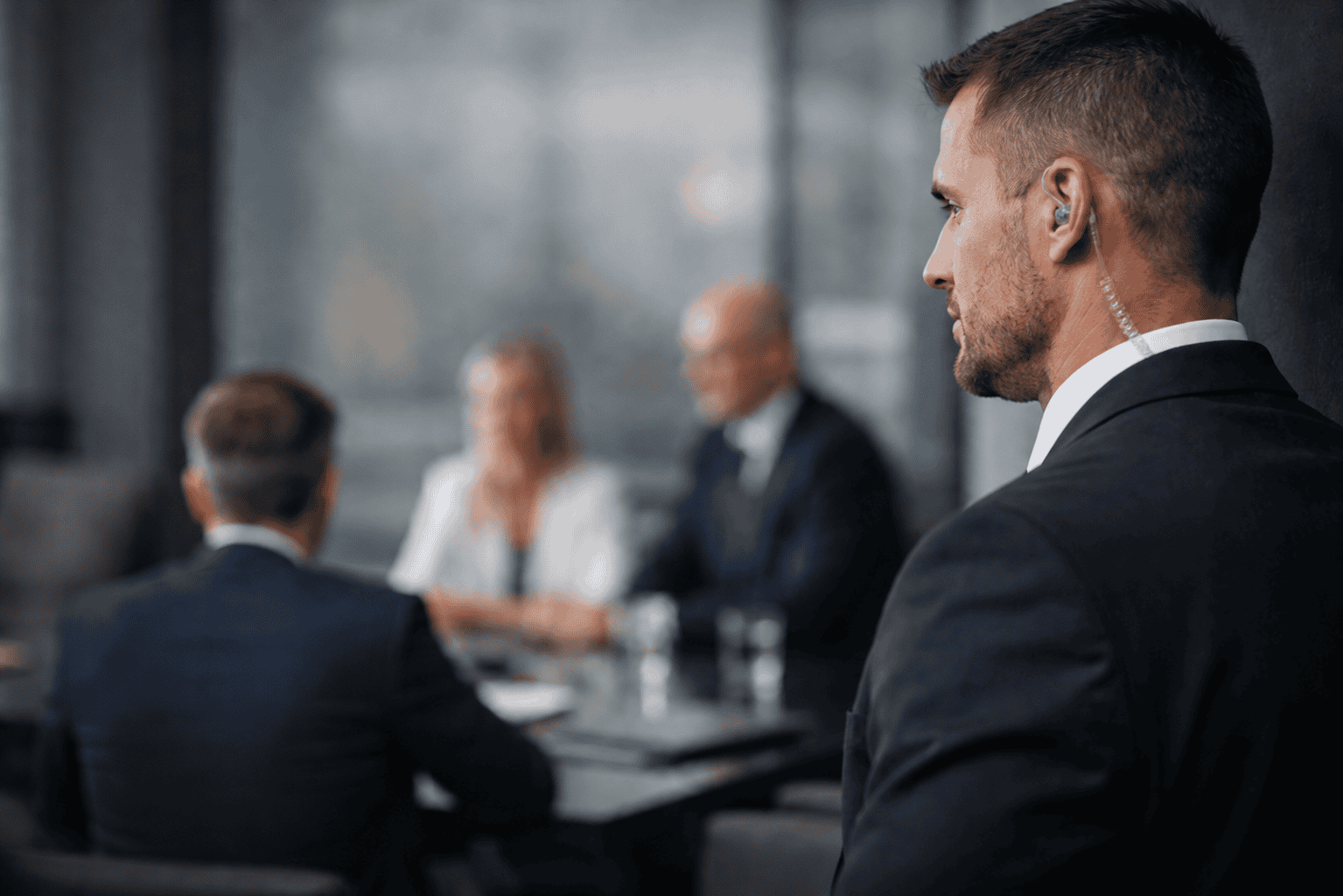 Security guard at corporate meeting table