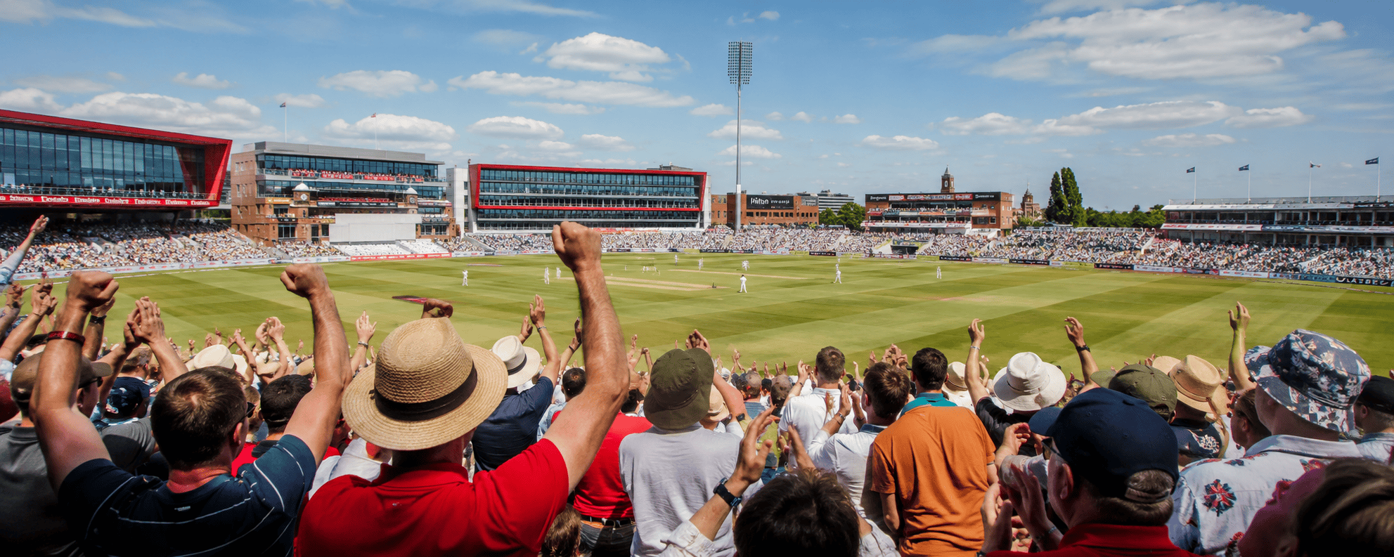 Crowd cheering at a cricket stadium during a match.