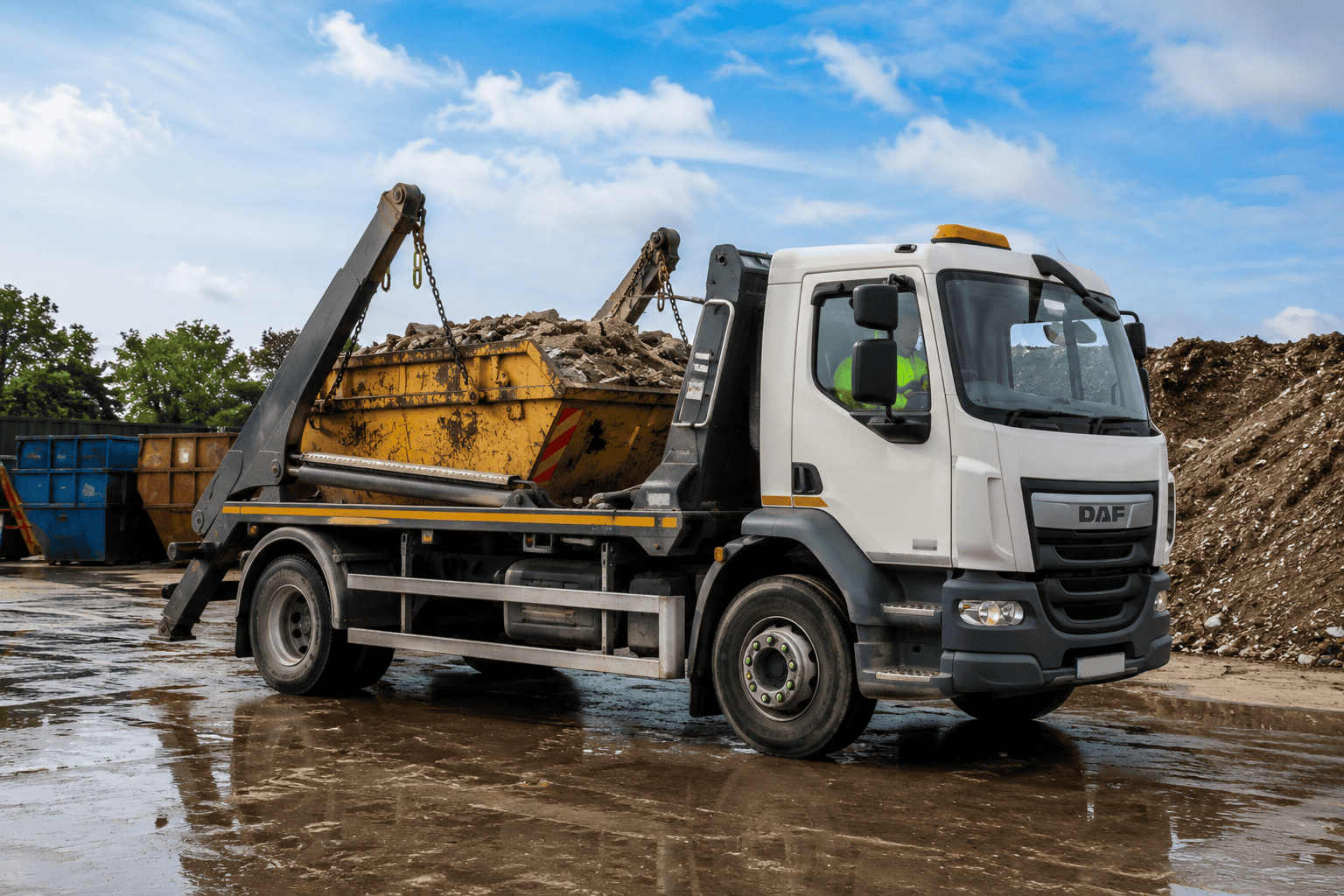 Industrial skip truck in waste yard Industrial skip truck in waste yard